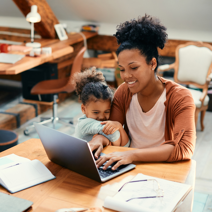coaching business owner trying to get more leads for her business while her child clings to her arm